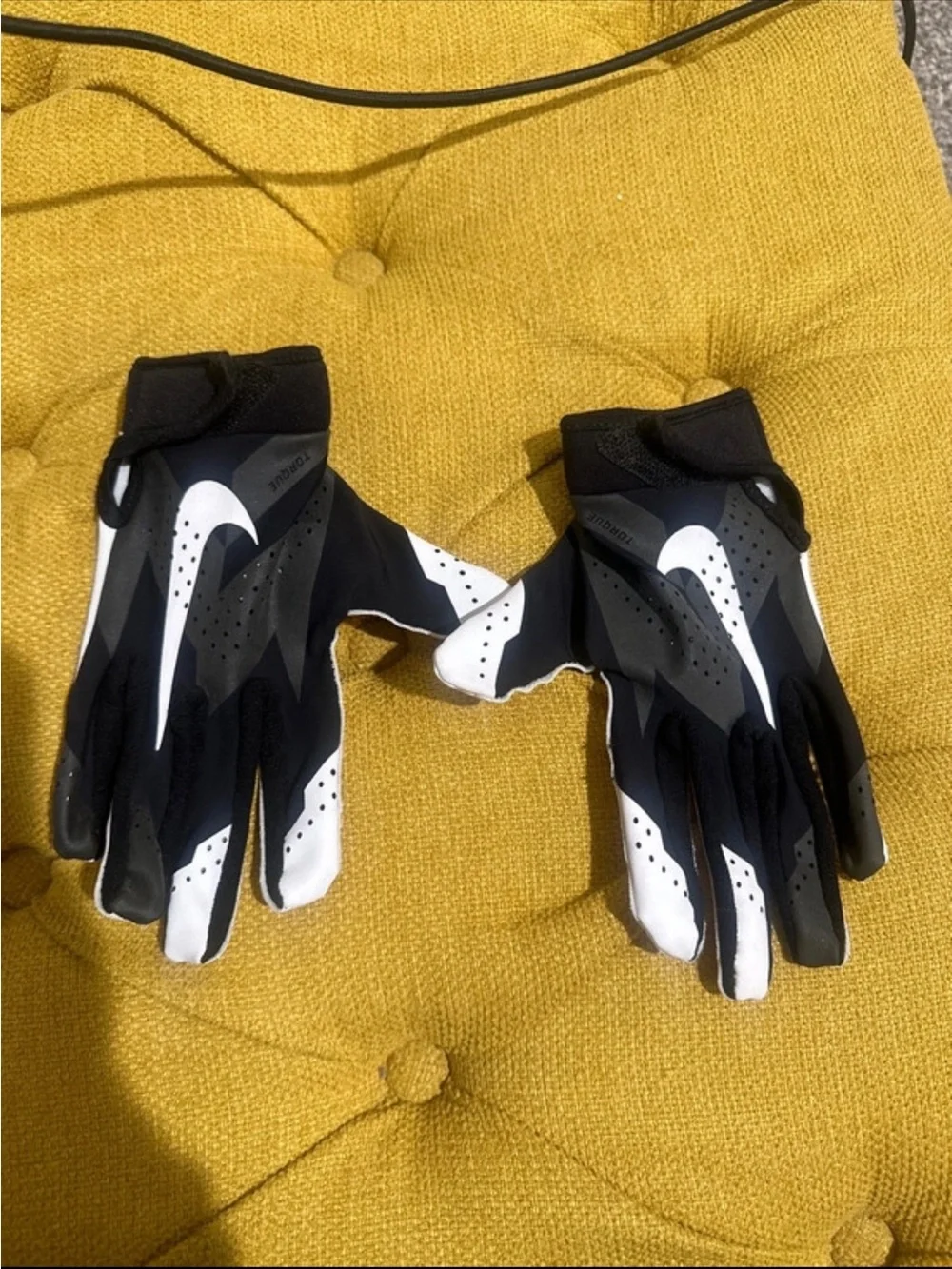 Nike youth medium Black and White football Gloves